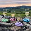 Beautiful landscape with wine glasses displayed on uneven rocks